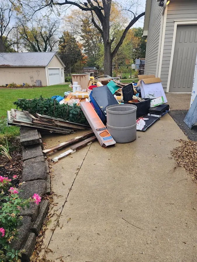 Dumpster being loaded with debris for Commercial Dumpster Rental in Sunderland